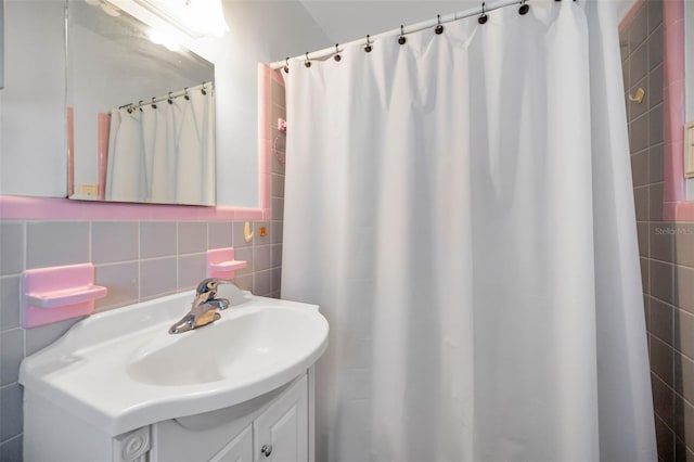 7740 Boca Ciega Dr Unit 204, St Pete Beach, FL 33706 - bathroom with vanity, tile walls, and a shower with shower curtain