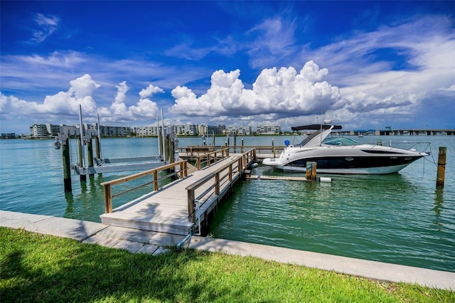 7740 Boca Ciega Dr Unit 204, St Pete Beach, FL 33706 - dock featuring boat lift and a water view