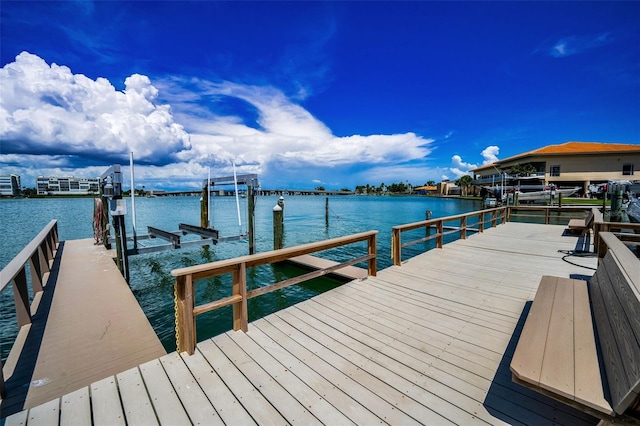 7740 Boca Ciega Dr Unit 204, St Pete Beach, FL 33706 - dock area with boat lift and a water view