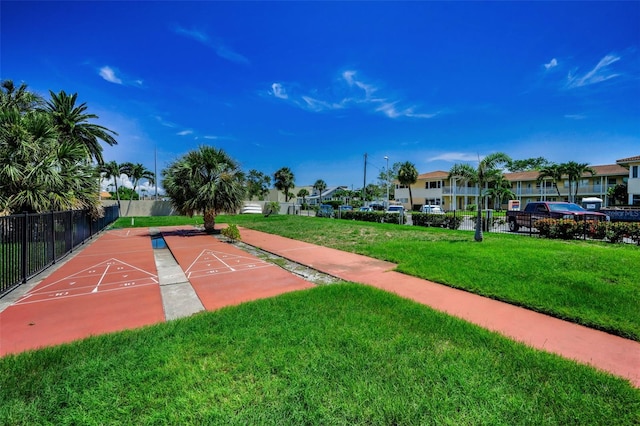 7740 Boca Ciega Dr Unit 204, St Pete Beach, FL 33706 - view of community featuring shuffleboard and a residential view