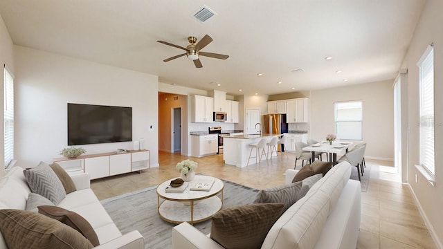 10827 High Noon Trl, Parrish, FL 34219 - living room with plenty of natural light, ceiling fan, light tile patterned floors, and recessed lighting