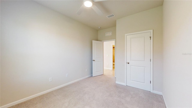 10827 High Noon Trl, Parrish, FL 34219 - unfurnished bedroom with light colored carpet and a ceiling fan