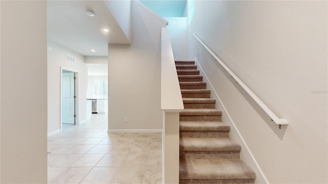 10827 High Noon Trl, Parrish, FL 34219 - stairs with tile patterned flooring and recessed lighting