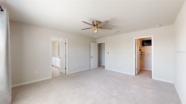 10827 High Noon Trl, Parrish, FL 34219 - unfurnished bedroom featuring light colored carpet, a spacious closet, a closet, a ceiling fan, and connected bathroom