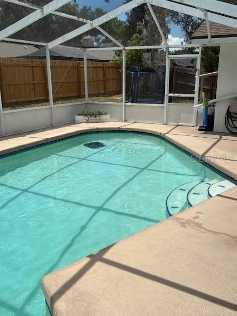 2527 Arborwood Dr, Valrico, FL 33596 - view of swimming pool with a patio and a lanai