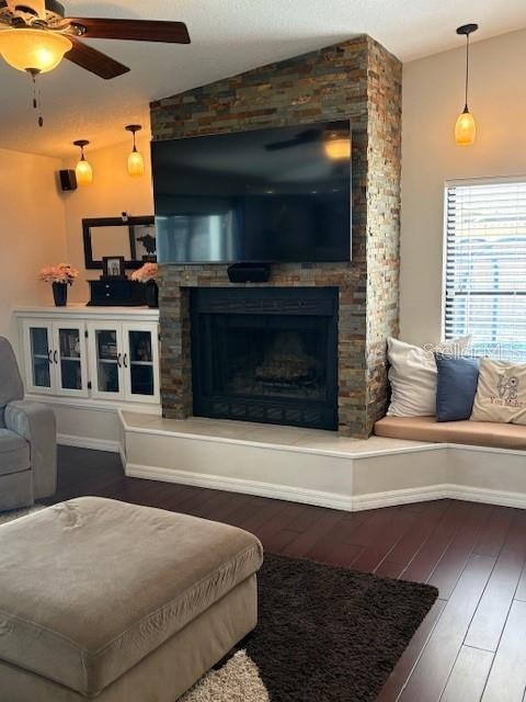 2527 Arborwood Dr, Valrico, FL 33596 - living room with lofted ceiling, wood-type flooring, a fireplace, and ceiling fan