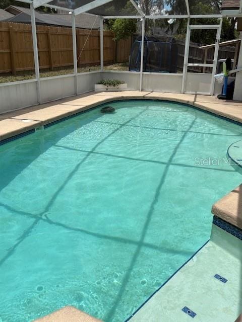 2527 Arborwood Dr, Valrico, FL 33596 - view of pool featuring glass enclosure, a fenced backyard, and a patio