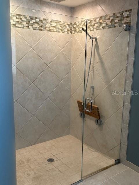2527 Arborwood Dr, Valrico, FL 33596 - bathroom featuring a stall shower and tile patterned flooring