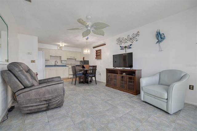 4357 Tahitian Gardens Cir Unit B, Holiday, FL 34691 - living area with a ceiling fan and light tile patterned flooring