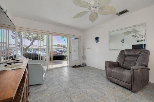 4357 Tahitian Gardens Cir Unit B, Holiday, FL 34691 - living area with ceiling fan and light tile patterned flooring