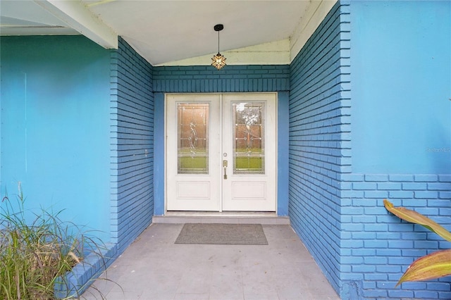 1712 Robin Hood Ln, Clearwater, FL 33764 - entrance to property featuring french doors and brick siding
