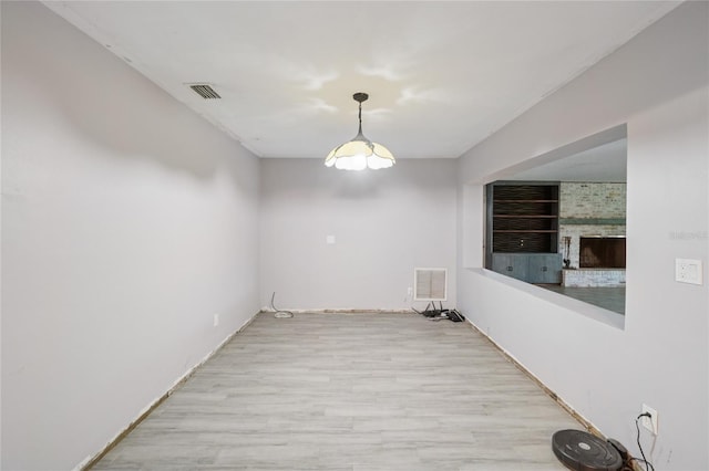 1712 Robin Hood Ln, Clearwater, FL 33764 - unfurnished room featuring wood finished floors and a fireplace