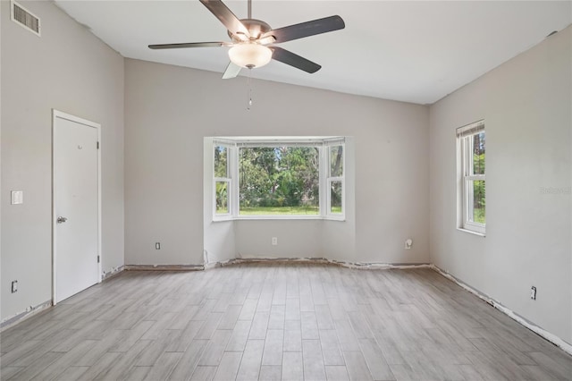 1712 Robin Hood Ln, Clearwater, FL 33764 - spare room featuring ceiling fan, lofted ceiling, and light wood-style flooring