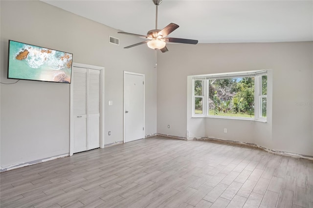 1712 Robin Hood Ln, Clearwater, FL 33764 - unfurnished bedroom with light wood finished floors, ceiling fan, and lofted ceiling