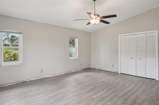 1712 Robin Hood Ln, Clearwater, FL 33764 - unfurnished bedroom featuring light wood-style floors, a closet, and a ceiling fan