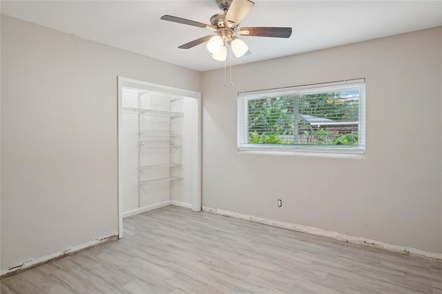 1712 Robin Hood Ln, Clearwater, FL 33764 - spare room with wood finished floors and a ceiling fan