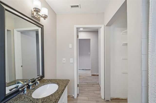 1712 Robin Hood Ln, Clearwater, FL 33764 - bathroom featuring wood finished floors and vanity