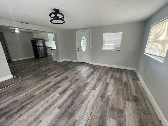 1225 Nemeth St, Auburndale, FL 33823 - foyer entrance featuring dark wood finished floors and baseboards