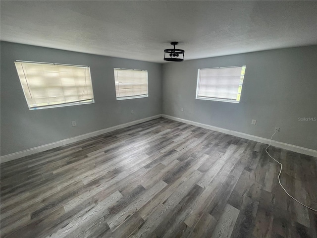 1225 Nemeth St, Auburndale, FL 33823 - empty room with dark wood-type flooring and baseboards