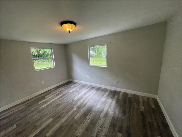 1225 Nemeth St, Auburndale, FL 33823 - empty room with dark wood-style flooring and baseboards
