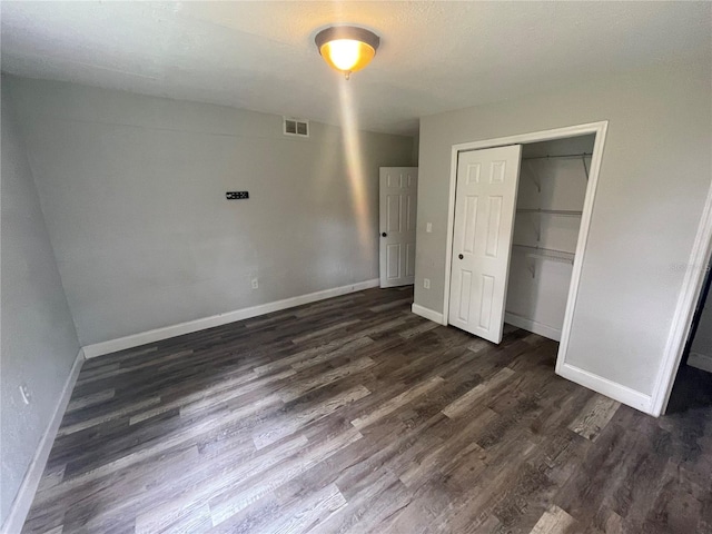 1225 Nemeth St, Auburndale, FL 33823 - unfurnished bedroom featuring dark wood-style floors and a closet