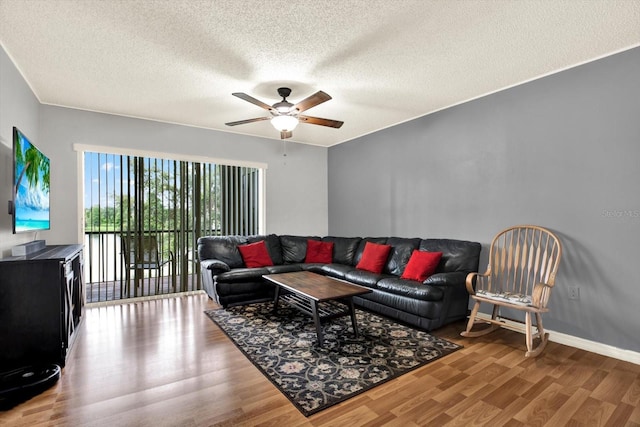 250 Cypress Ln, Oldsmar, FL 34677 - living room featuring wood finished floors, ceiling fan, and a textured ceiling