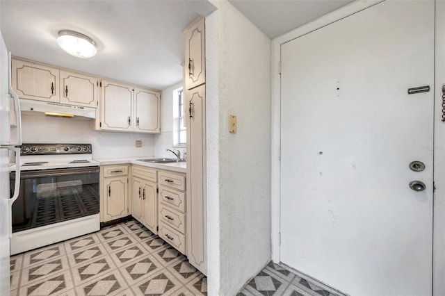 5245 Amulet Dr Unit 201, New Port Richey, FL 34652 - kitchen featuring electric range, under cabinet range hood, light countertops, cream cabinetry, and light flooring