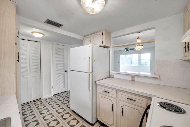 5245 Amulet Dr Unit 201, New Port Richey, FL 34652 - kitchen featuring white appliances, light countertops, and ceiling fan