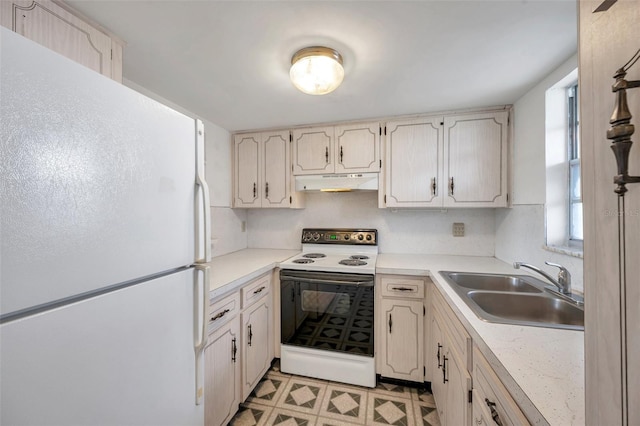 5245 Amulet Dr Unit 201, New Port Richey, FL 34652 - kitchen with white appliances, under cabinet range hood, light countertops, and light flooring