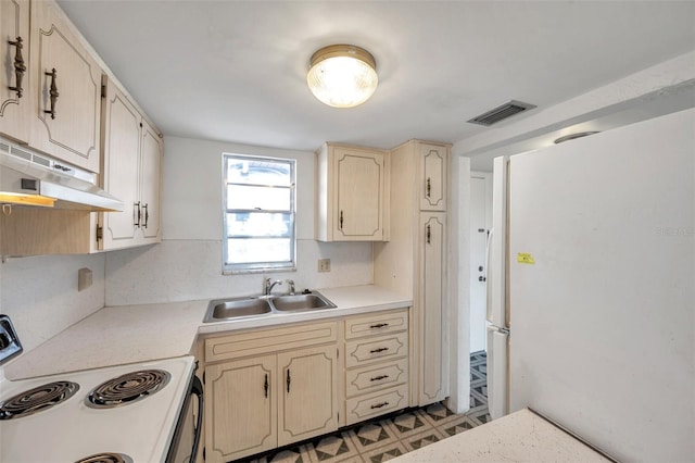 5245 Amulet Dr Unit 201, New Port Richey, FL 34652 - kitchen featuring white appliances, under cabinet range hood, light countertops, light floors, and backsplash