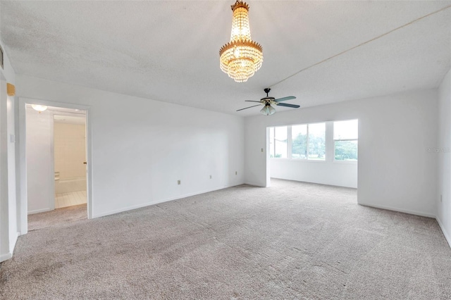 5245 Amulet Dr Unit 201, New Port Richey, FL 34652 - carpeted empty room featuring ceiling fan and a chandelier