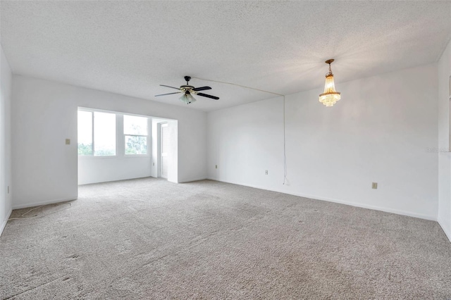 5245 Amulet Dr Unit 201, New Port Richey, FL 34652 - spare room with light colored carpet, ceiling fan, and a textured ceiling