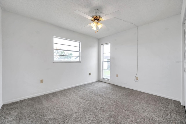 5245 Amulet Dr Unit 201, New Port Richey, FL 34652 - empty room featuring carpet, a textured ceiling, and a ceiling fan