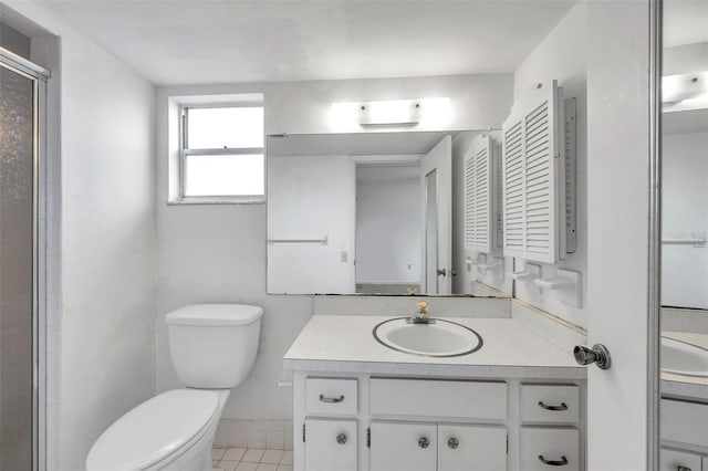 5245 Amulet Dr Unit 201, New Port Richey, FL 34652 - full bath featuring vanity, a shower with door, and tile patterned flooring
