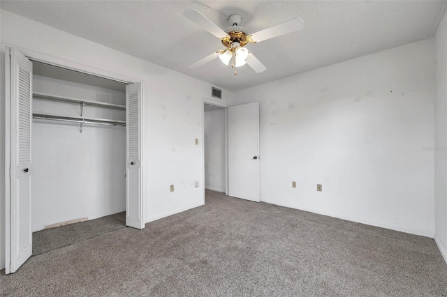 5245 Amulet Dr Unit 201, New Port Richey, FL 34652 - unfurnished bedroom with carpet floors, a closet, and a ceiling fan