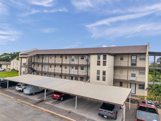 5245 Amulet Dr Unit 201, New Port Richey, FL 34652 - view of apartment building / complex with covered parking