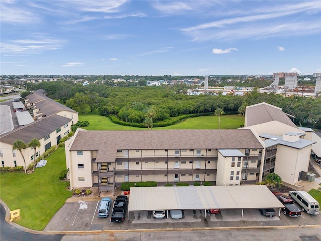 5245 Amulet Dr Unit 201, New Port Richey, FL 34652 - drone / aerial view of a tree filled landscape and apartment complex / building