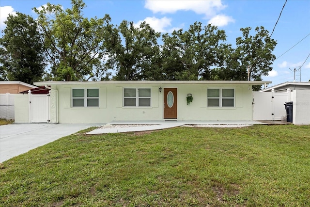 1712 W Atkinson St, Tampa, FL 33604 - single story home featuring a gate, driveway, and stucco siding
