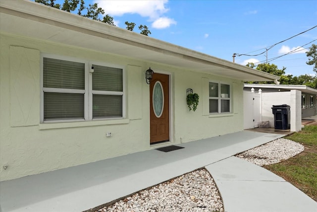 1712 W Atkinson St, Tampa, FL 33604 - view of exterior entry featuring stucco siding