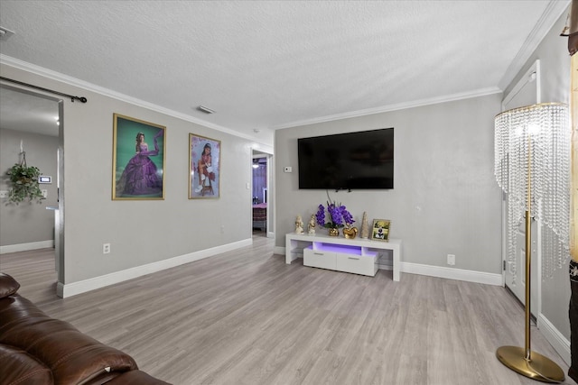 1712 W Atkinson St, Tampa, FL 33604 - living area featuring wood finished floors, crown molding, and a textured ceiling