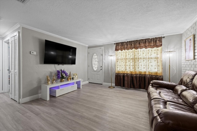 1712 W Atkinson St, Tampa, FL 33604 - living area with ornamental molding, wood finished floors, and a textured ceiling