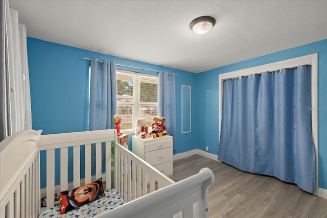 1712 W Atkinson St, Tampa, FL 33604 - bedroom with wood finished floors and baseboards