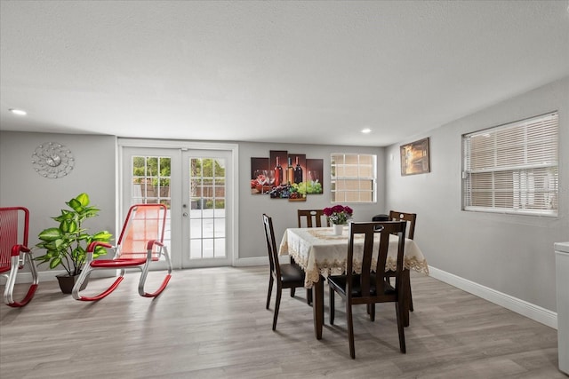 1712 W Atkinson St, Tampa, FL 33604 - dining room featuring wood finished floors, french doors, and recessed lighting