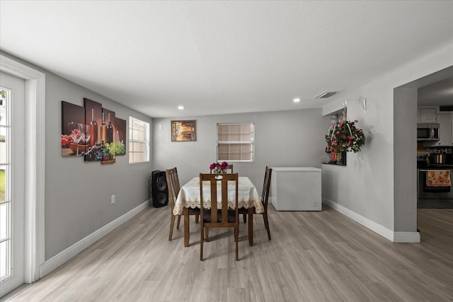 1712 W Atkinson St, Tampa, FL 33604 - dining space with light wood-style floors and recessed lighting