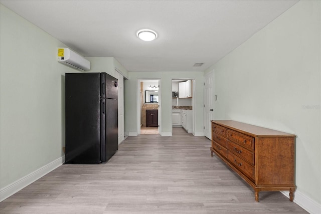 1712 W Atkinson St, Tampa, FL 33604 - hall with a wall unit AC and light wood-type flooring