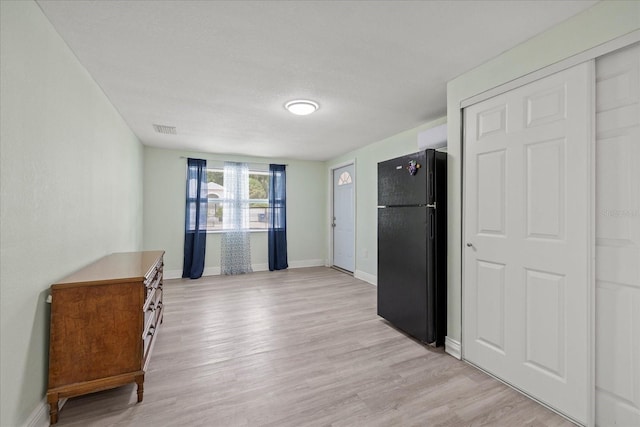 1712 W Atkinson St, Tampa, FL 33604 - kitchen with freestanding refrigerator and light wood-style floors