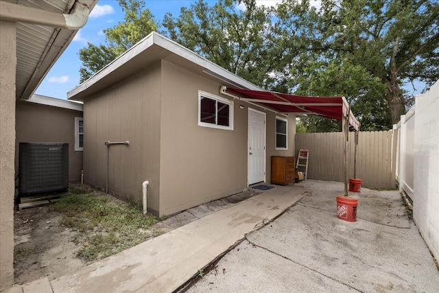 1712 W Atkinson St, Tampa, FL 33604 - view of property exterior with a patio and a central air condition unit