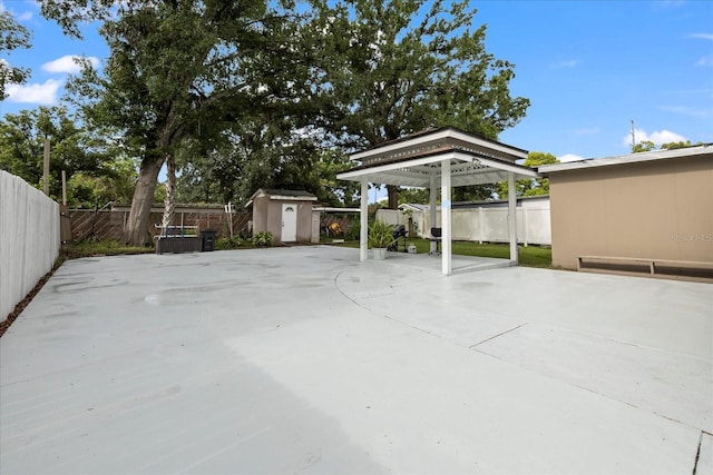 1712 W Atkinson St, Tampa, FL 33604 - fenced backyard with a storage shed, a gazebo, and a patio area