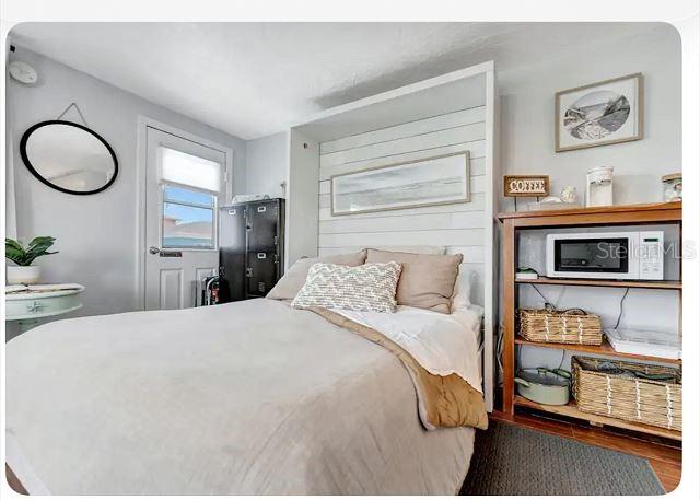 483 E Shore Dr Unit B4, Clearwater Beach, FL 33767 - bedroom with wood finished floors