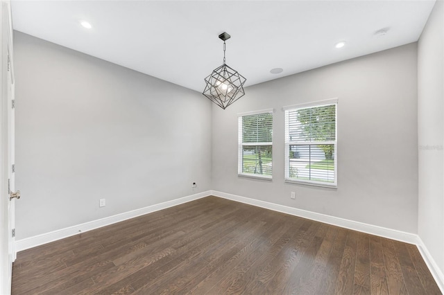 5434 Silver Sun Dr, Apollo Beach, FL 33572 - spare room featuring a smoke detector, dark wood-style flooring, and recessed lighting
